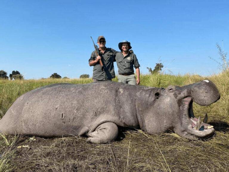 Author Pierre van Wyk poses with his hippo and the local outfitter during his hippo hunting safari in Namibia