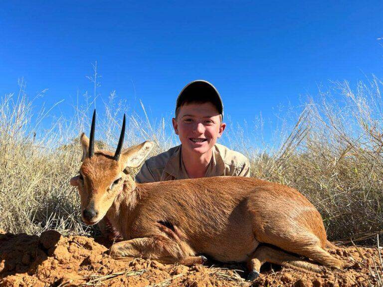 Slade Poses with his Tiny Ten Duiker Hunting Trophy